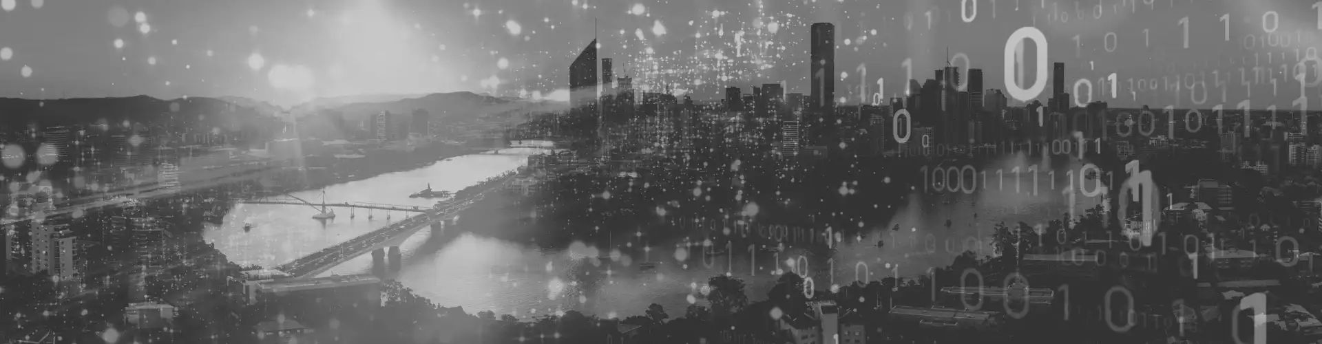 Programming code with Brisbane cityscape