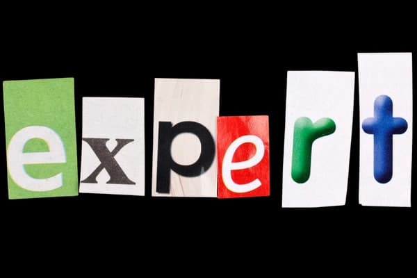 Expert written in paper cutouts