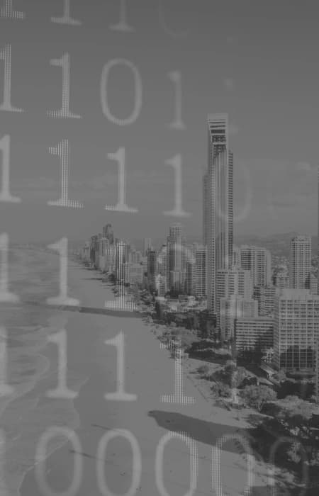Programming code with Gold Coast skyline